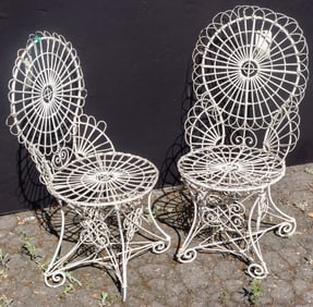 A pair of Victorian style painted wirework metal garden chairs