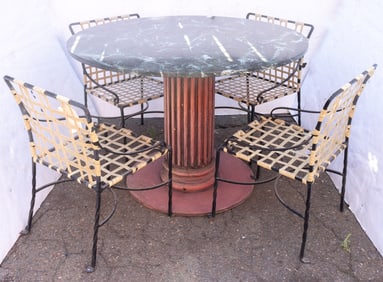 A set of four outdoor dining chairs