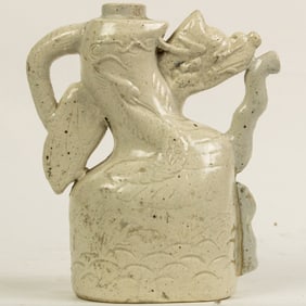 Chinese white glazed 'dragon' wine pot