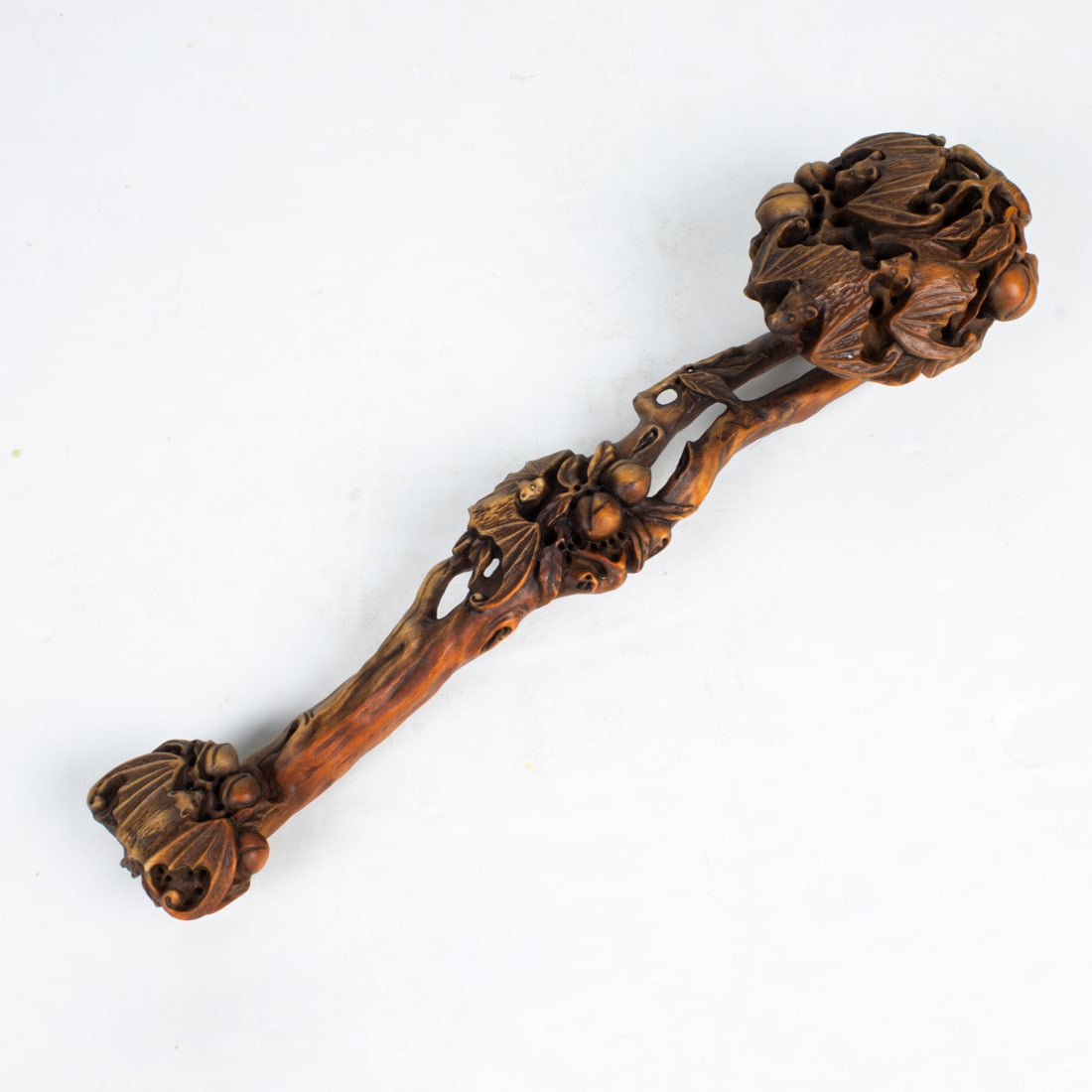 Chinese wood ruyi scepter: Chinese wood ruyi scepter. 11.5" across.