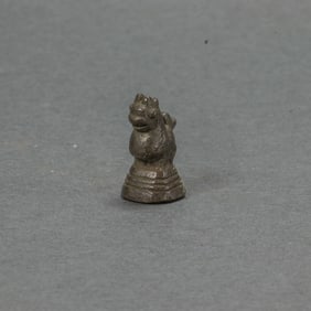 A collection of Burmese bronze opium weights