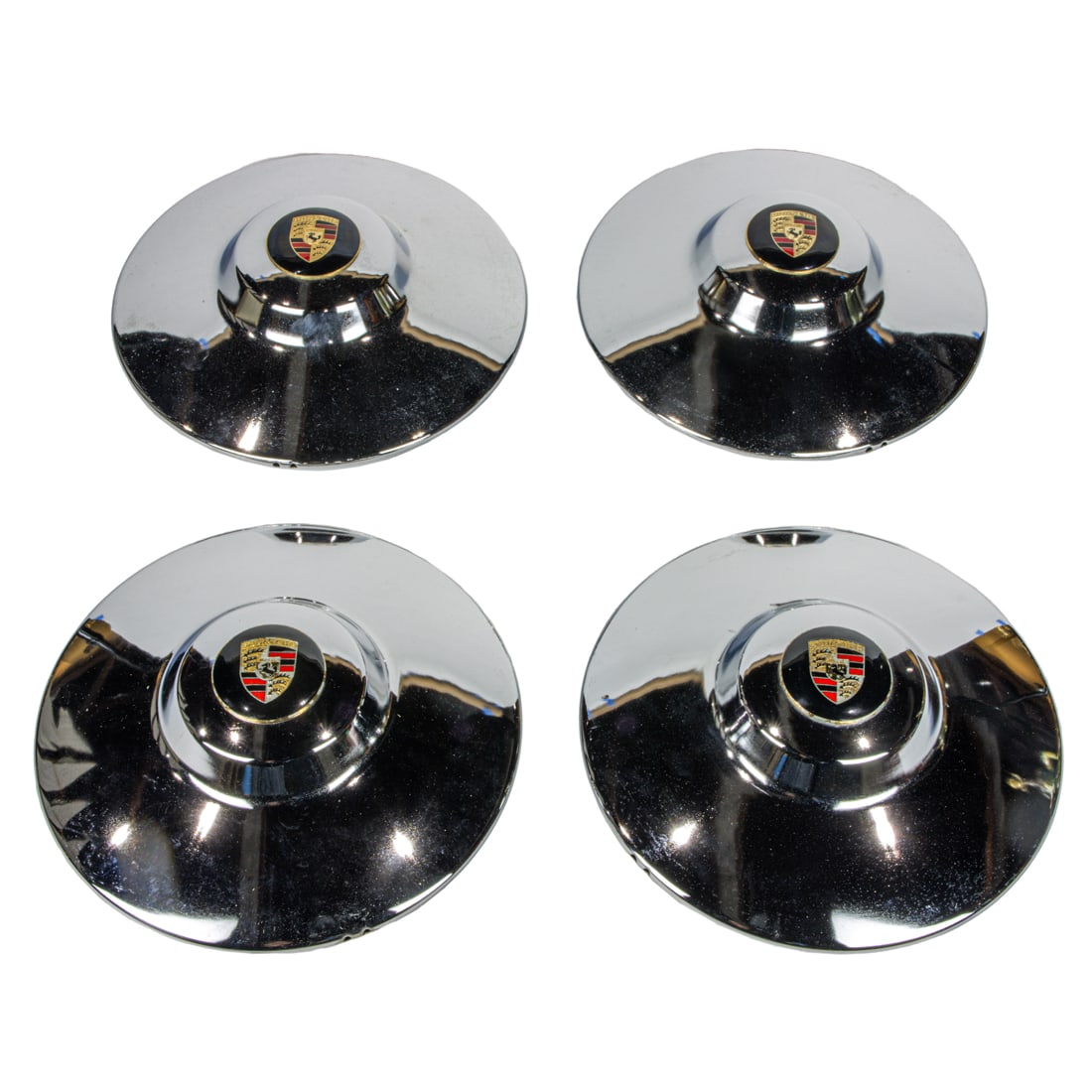 A set of Porsche 356 A/B "Super" chrome nipple hubcaps: A set of Porsche 356 A/B "Super" chrome nipple hubcaps, with gold enameled crest for drum brake wheels. Note: A portion of sales proceeds will benefit nonprofit pet rescue organizations in the San Fra