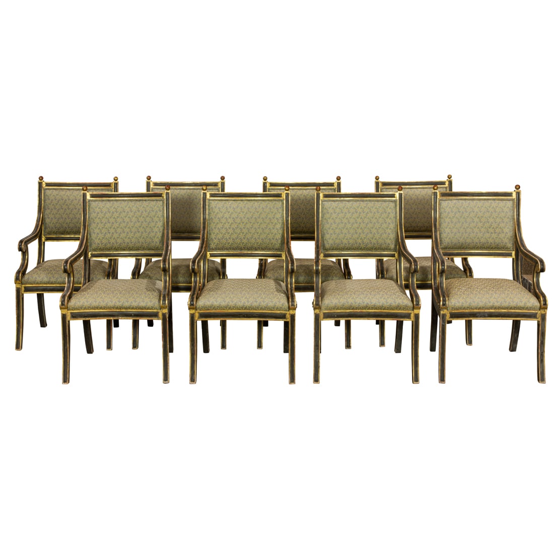 A set of eight custom carved and partial gilt Klismos armchairs: A set of eight custom carved and partial gilt Klismos armchairs, each with a finial capped concave padded back, the arms with a scroll decorated return, and rising on outswept legs