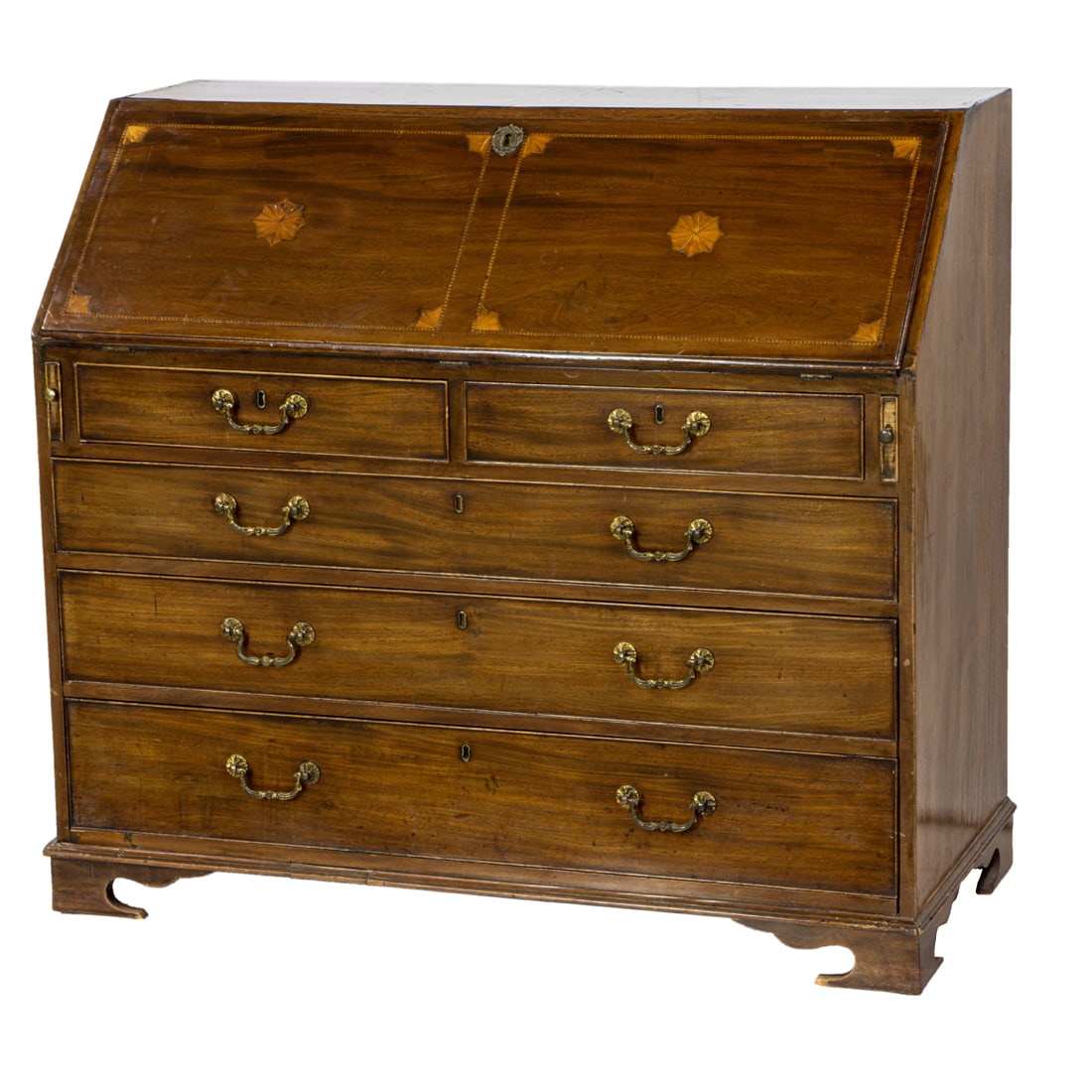 A Regency partial ebonized and marquetry decorated desk: A Regency partial ebonized and marquetry decorated desk, executed in mahogany, the slant front opening to a fitted interior with two banks for four drawers flanking the central drawer, each with inlai