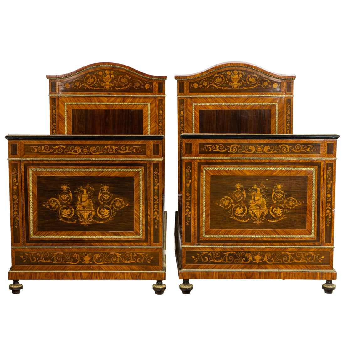A set of Louis XVI style marquetry decorated beds: A set of Louis XVI style marquetry decorated beds, each with urn and floral medallions surrounded by the bronze mounts, and rising on turned feet, each bed 59"h x 40"w x 77"d