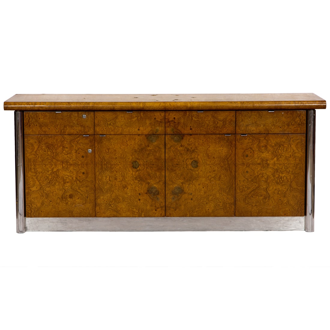 A Modern designed olive burl wood credenza: A Modern designed olive burl wood credenza, attributed to Paul Evans, consisting of four drawers over four cupboard doors, one section with file cabinet, rising on chrome cylindrical supports, 30"h x