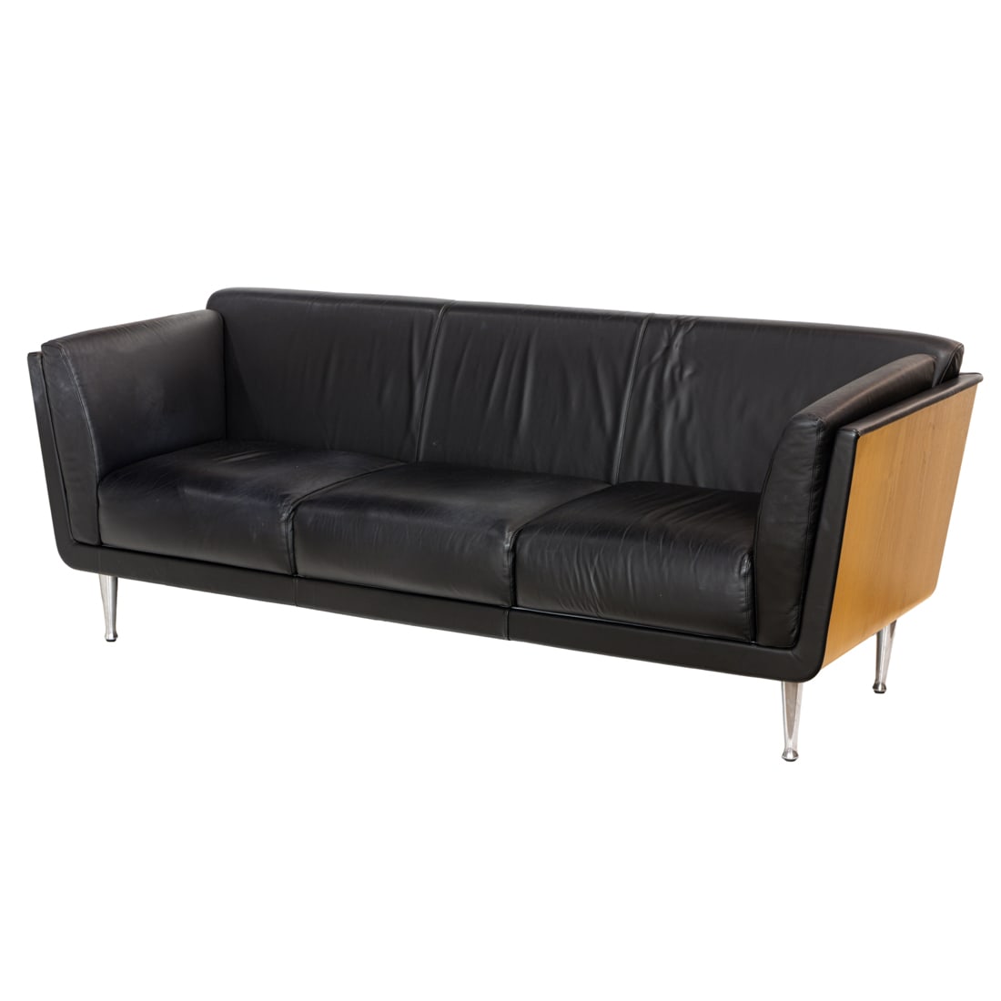 Design Within Reach leather sofa: Design Within Reach leather sofa, the sleek wraparound wood frame surrounding the supple leather cushions and rising on aluminum legs, marked Design Within Reach to underside, overall 33"h x 85"w x 31