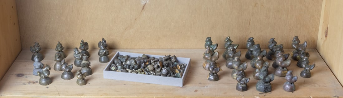 A collection of Burmese bronze opium weights (1 of 1)