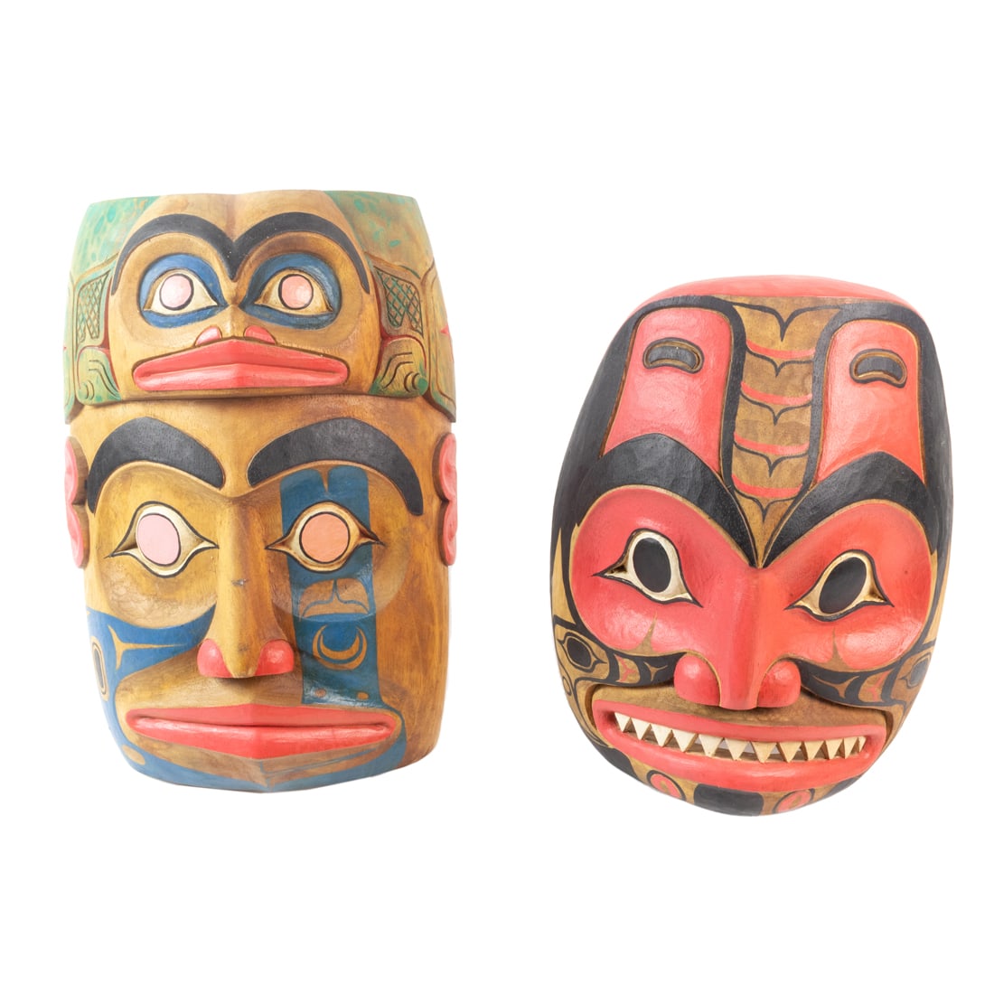 Two Haida style wall masks, painted and carved wood depicting a frog and a shark; 14"h x 9 1/2w x (1 of 2)