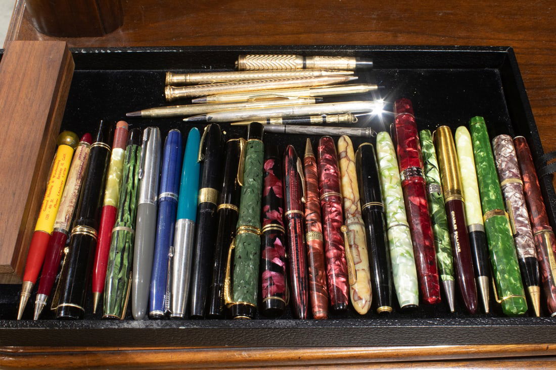 A lot of approximately thirty-two fountain pens and pencils, including (2) Cross gold filled roller (1 of 1)