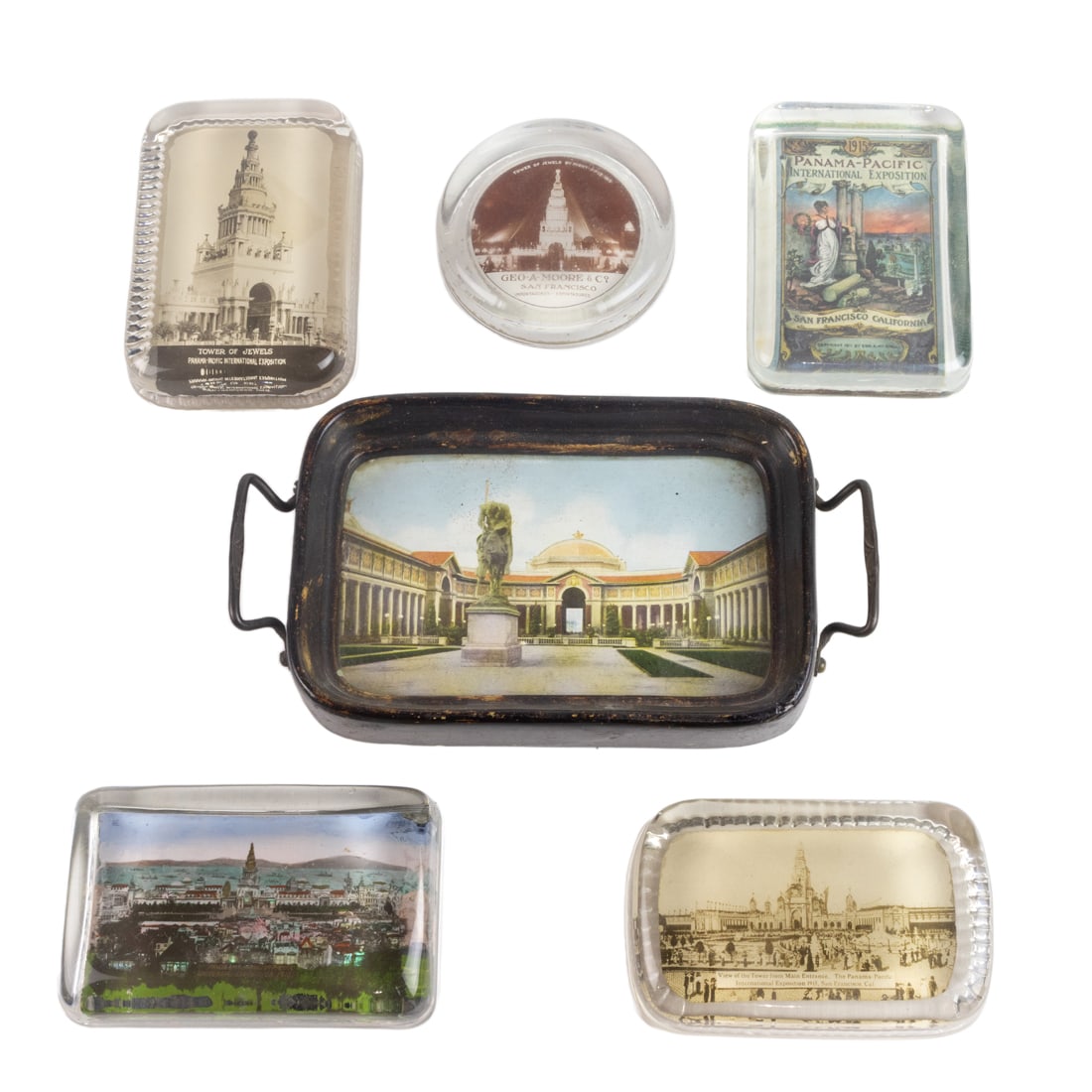 A group of 1915 Panama-Pacific International Exposition (PPIE) reverse decorated glass paperweights (1 of 8)
