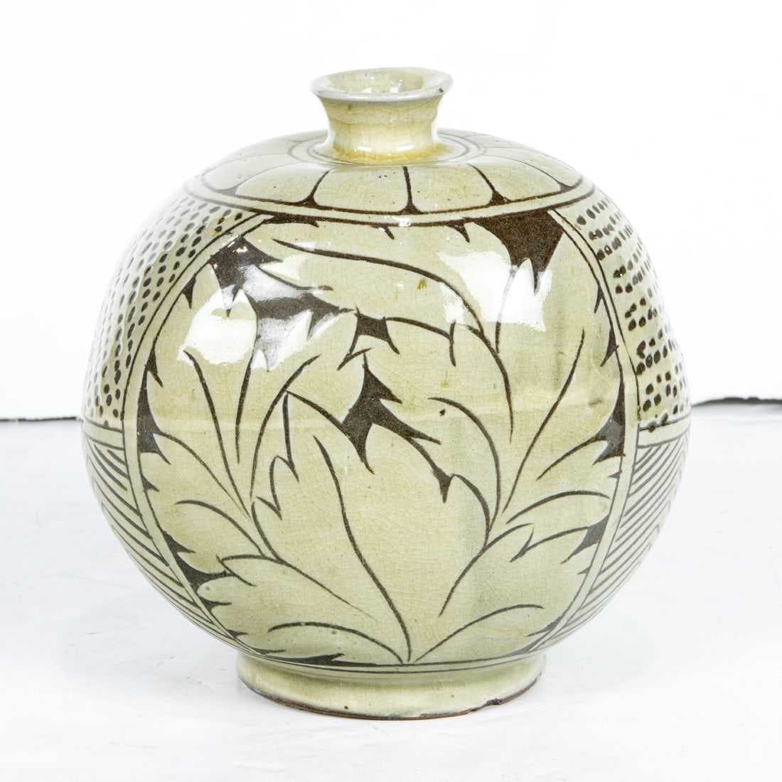 Korean slip decorated cracked glazed vase: Korean slip decorated cracked glazed vase. 6.5" high.