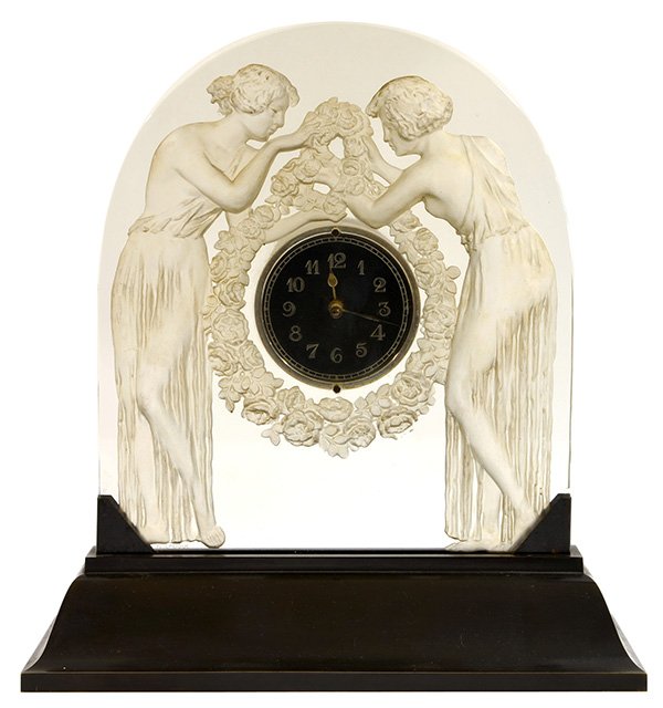 Rene Lalique 'Deux Figurines' clock: Rene Lalique ''Deux Figurines'' clear and frosted glass clock, model introduced in 1926 and depicts two maidens, each bearing the garland and floral swag surrounding the dial with etched Arabic numera