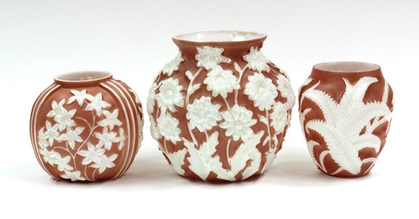 Phoenix Art Glass: (lot of 3) Phoenix art glass vases having rose fields and lustre pattern accents consisting of a Star Flower and Daisy pattern bulbous vases, and a Fern pattern tapered vase, tallest: 9.5''h. Provenan