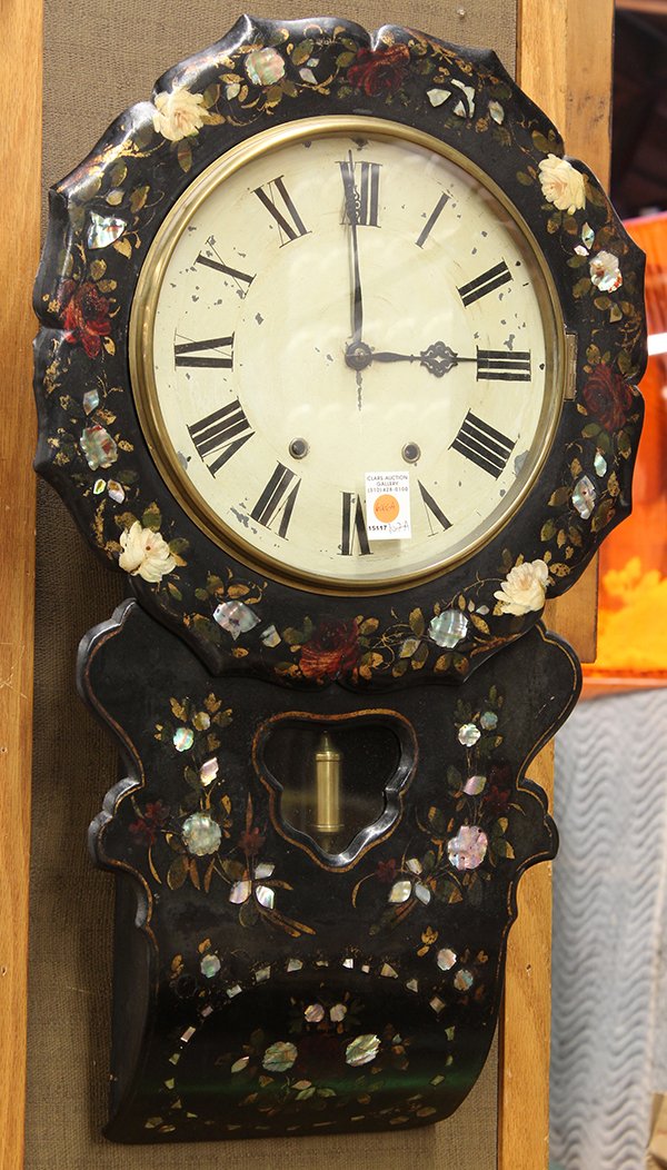 Victorian wall clock: Napoleon III papier mache wall clock circa 1870, the shaped case with mother of pearl and polychrome decorated accents surrounding the Roman markers, the lower case with a single partial gilt pendulum