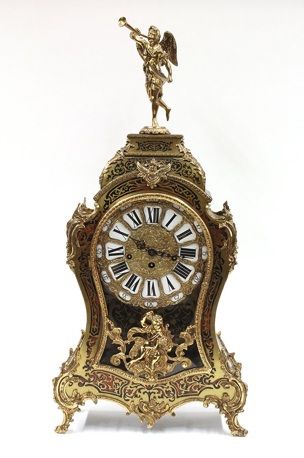 Louis XV style mantle clock: Louis XV style gilt bronze mounted mantle clock, the ormolu decorated figural finial surmounting the boulle style case having a single door opening to the gilt dial accented with raised Roman markers 