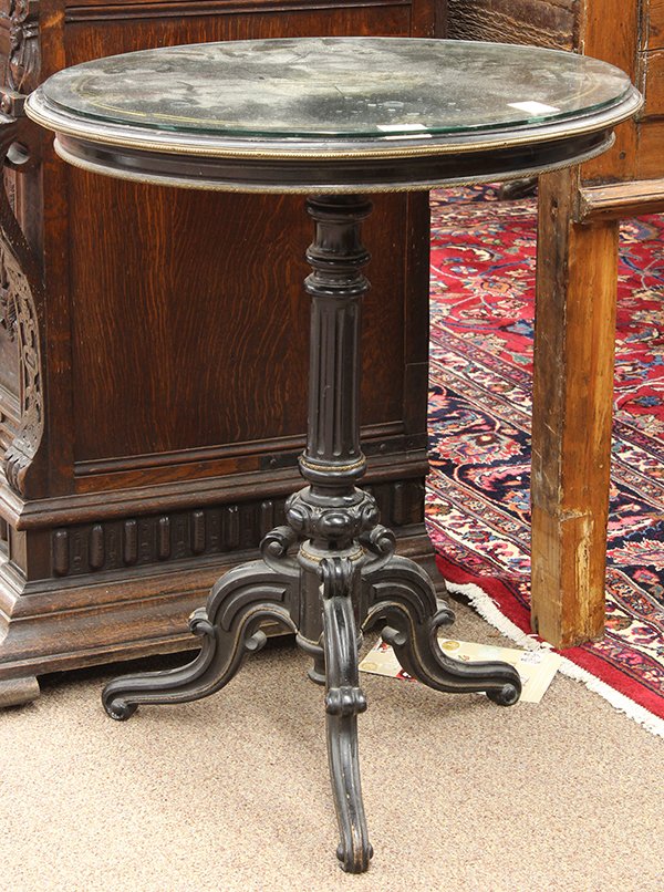 Napoleon III occasional table: Napoleon III inlaid occasional table, circa 1870, the oval top with brass inlaid reserves and gilt metal mounts above a turned standard with conforming mounts and rising on a tripod base terminating o