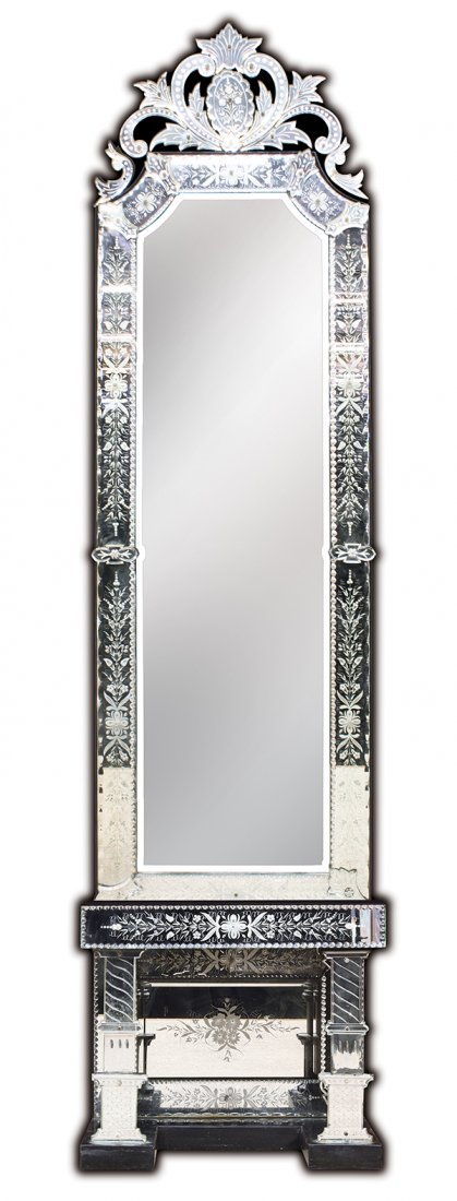 Venetian pier mirror: Venetian pier mirror on stand, circa 1900, the crest having an etched floral cartouche flanked with cut roundels continuing to the cut and etched border surrounding the bevelled central looking glass,