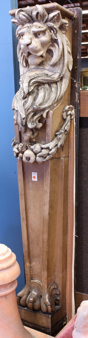Gladding McBean architectural elements: Pair of glazed terra cotta architectural columns attributed to Gladding McBean, each having a relief decorated lion form capital surmounting the garland swag rising on a tapered column terminating on 