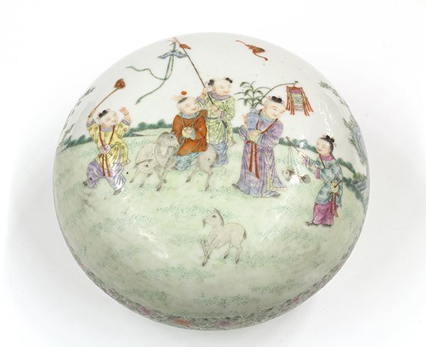 Chinese Enameled Porcelain Box: Chinese enameled porcelain circular box, the lid decorated with young children and three rams in a garden, the box painted with the three auspicious fruits (peach, pomegranate and Buddha hand citron) 
