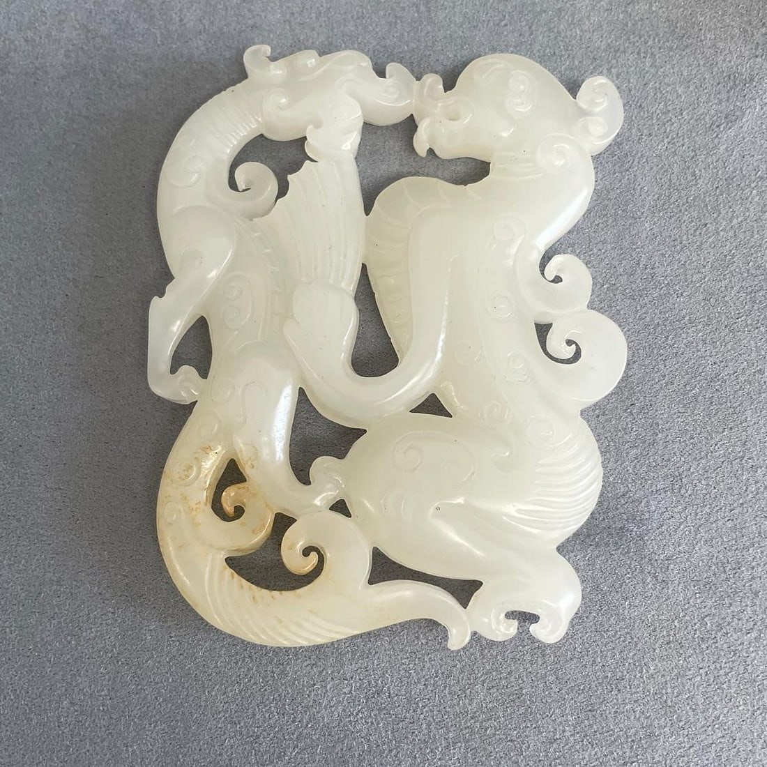 Carved White Jade: Carved white jade. Size: 3 1/4 x 2 3/4 in; gross weight 64 grams. NOTE: THIS ITEM IS IN OUR NEW YORK WAREHOUSE WHERE WE OFFER IN-HOUSE SHIPPING.