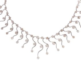 A diamond and 14k white gold ring