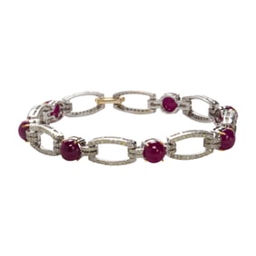 A ruby, diamond, silver and 14k gold bracelet