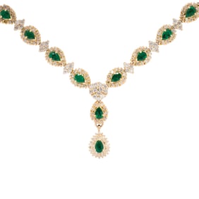 An emerald, diamond and 14k gold necklace
