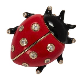 A black enamel, hardstone, diamond and 18k gold brooch