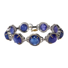 A tanzanite, diamond, silver and 14k gold bracelet