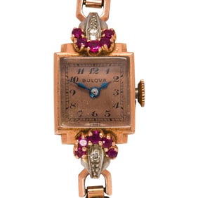 A Bulova, diamond, ruby and 14k rose gold watch bracelet