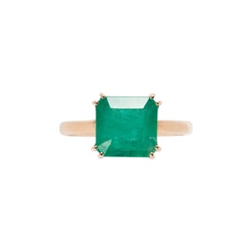 An emerald and 14k gold ring