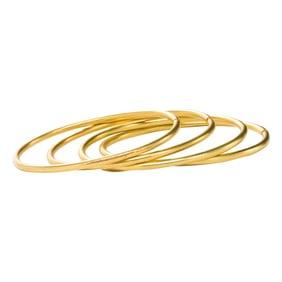 A set of four 18k gold bangles