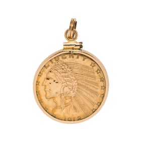 A gold coin motif 14k gold pendant