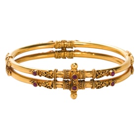 A ruby and 14k gold bangle bracelet