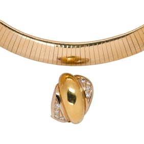 A diamond and 14k gold pendant necklace