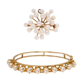 A pearl and 14k gold bracelet and brooch