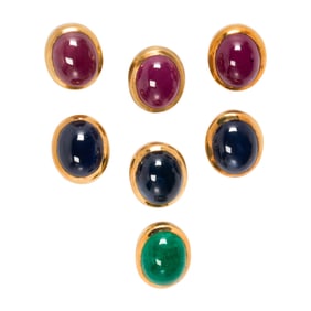 A group of bezel set gemstones and 14k gold