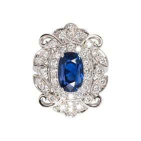 An unheated sapphire, diamond and 14k white gold ring