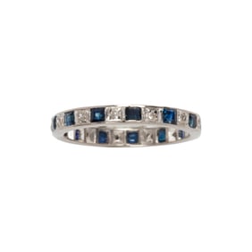A sapphire, diamond and 18k white gold eternity band