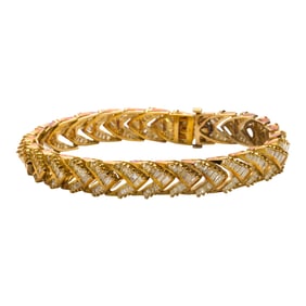 A diamond and 14k gold bracelet