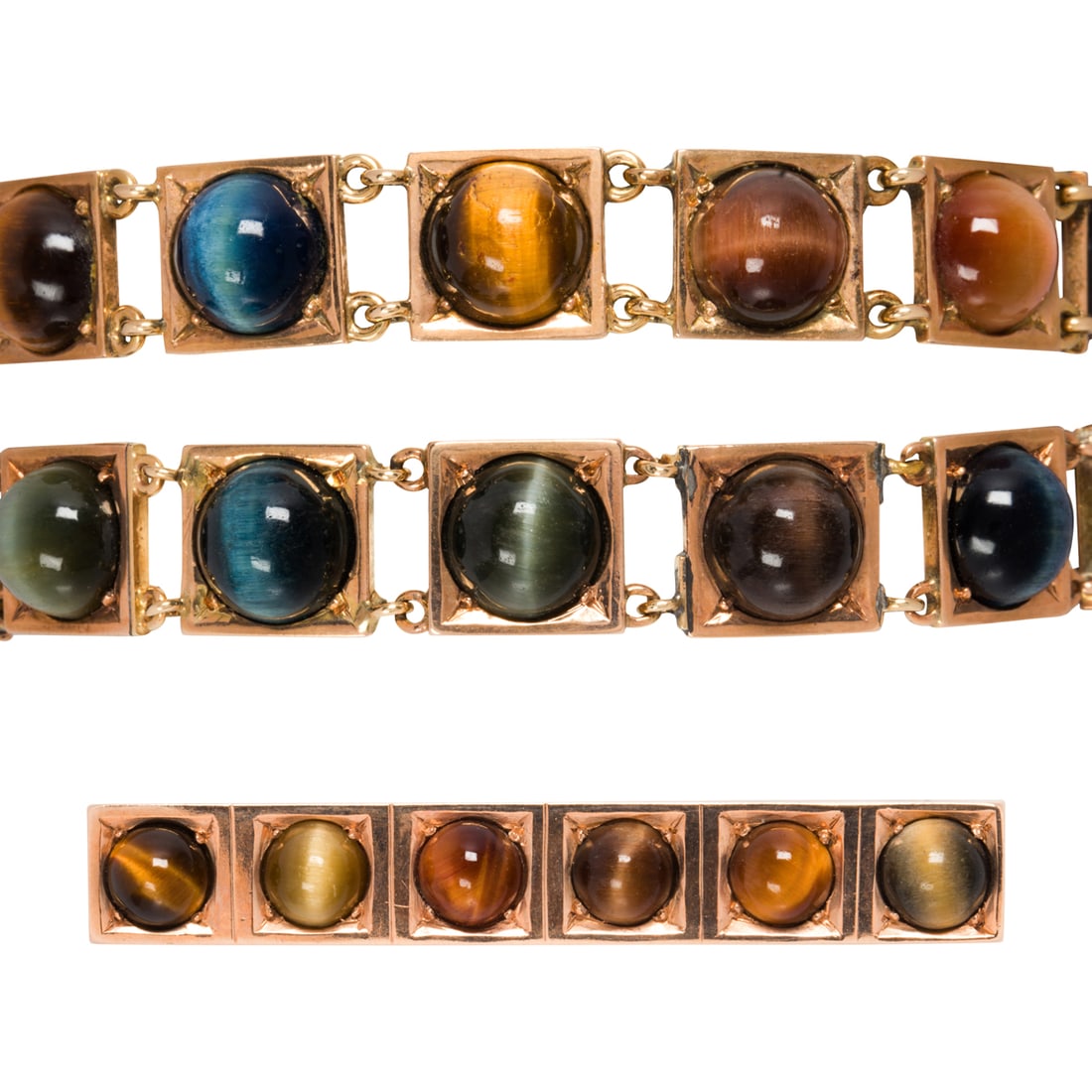 A group of cat's eye chrysoberyl, tiger's eye and gold jewelry: A group of cat's eye chrysoberyl, tiger's eye and gold jewelry comprising two 10k gold square link bracelets and one 14k gold bar brooch, set with round tiger's eye and multi-hued cat's eye cabochons;