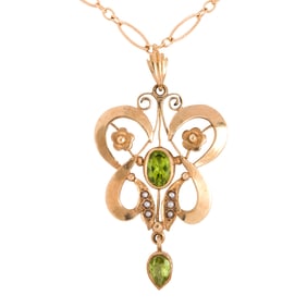 A peridot, seed pearl and gold pendant and chain