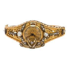 A diamond, pearl and 14k gold covered watch bangle bracelet