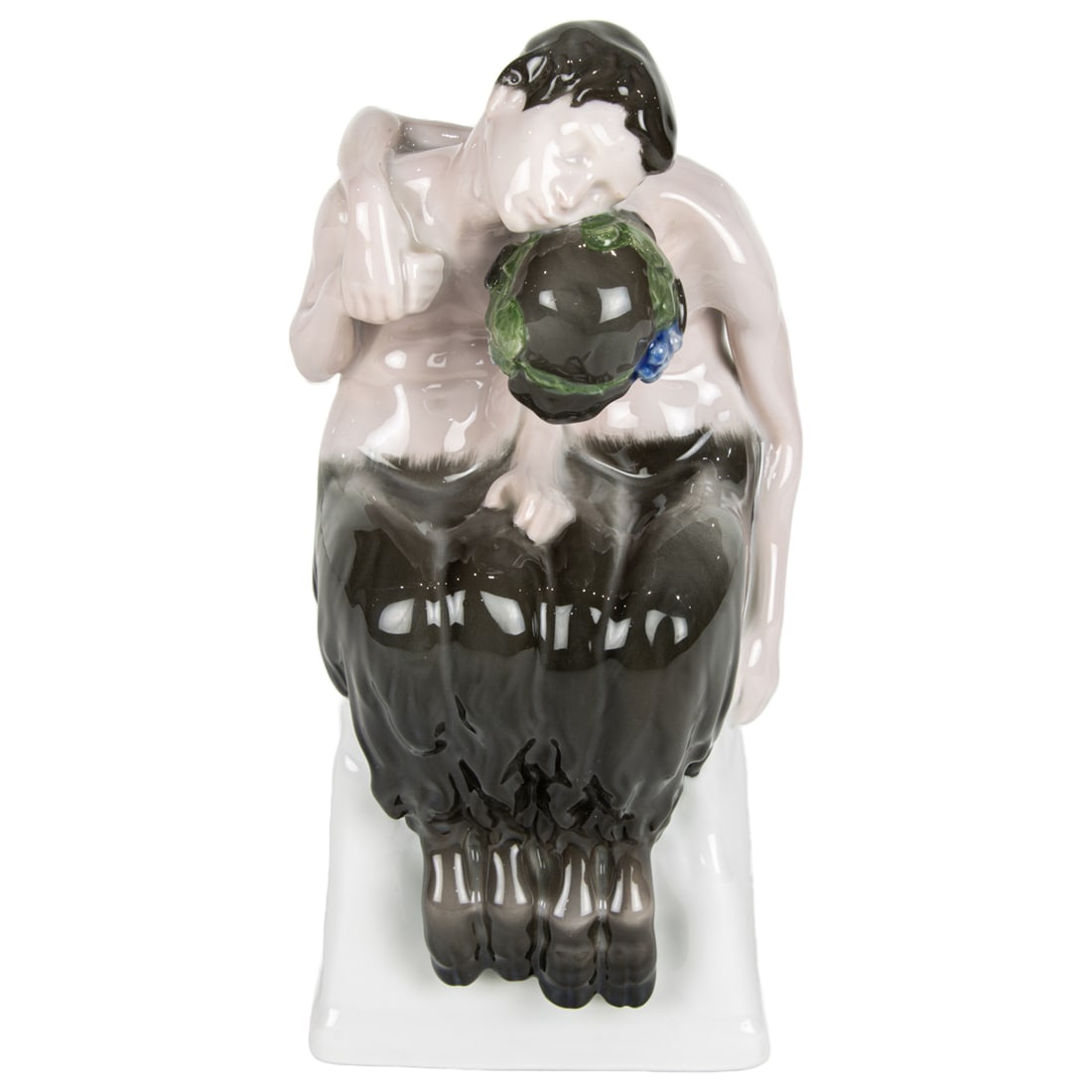 A Rosenthal porcelain figural group: Schalafende Faune (Sleeping Faun): A Rosenthal porcelain figural group: Schalafende Faune (Sleeping Faun), designed by Albert Caasmann, early 20th century, signed in mold, underglaze blue factory marks, 9.5"h