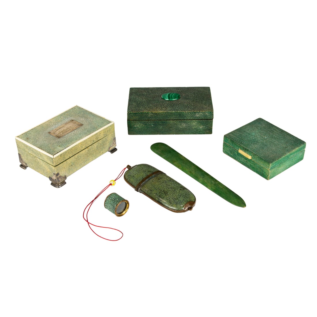 Three Continental shagreen veneered boxes: Three Continental shagreen veneered boxes, each of green stained and hinged rectangular form, including one with ivory banded lid and rising on silver feet, the largest with an applied faux malachite