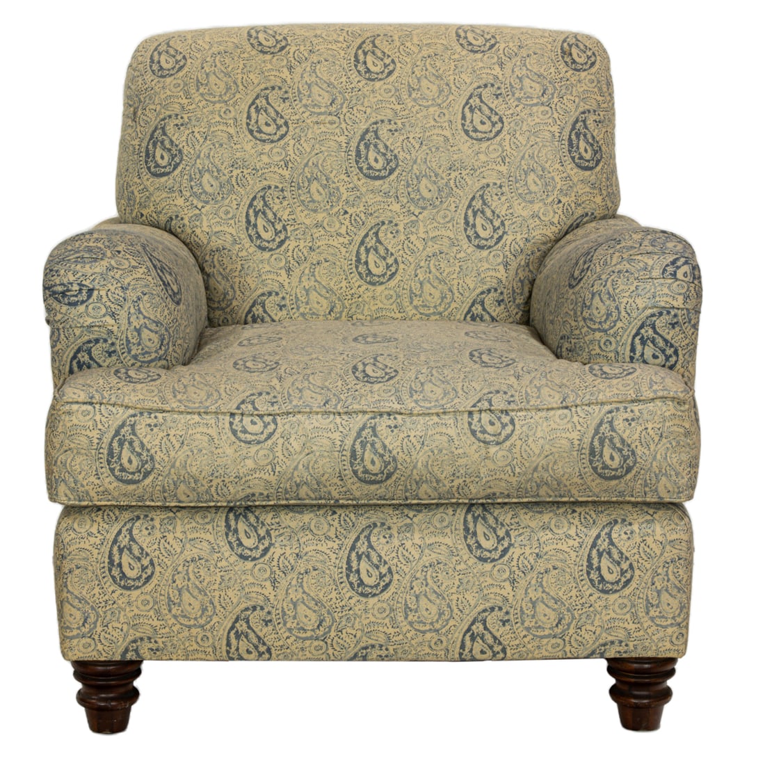A Ralph Lauren overstuffed armchair, upholstered in Pierre Deux style paisley fabric: A Ralph Lauren overstuffed armchair, down filled and upholstered in blue and white paisley fabric, rising on turned legs in front, block legs in back, 34"h x 34"w x 34.5"d