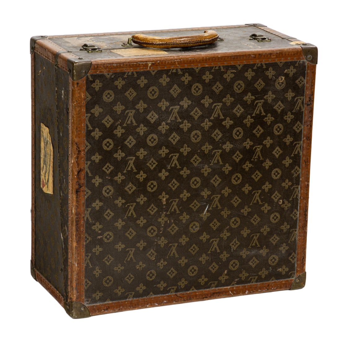 A Louis Vuitton monogram hat box or travel trunk: A Louis Vuitton monogram hat box or travel trunk, first half 20th century, lock marked 'Louis / Vuitton / Made in France', exterior with Railway Express tags, interior with label inscribed 'Bought fro