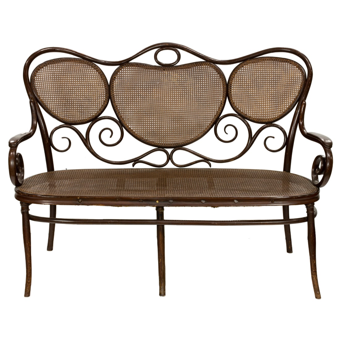 A Josef Hofmann bentwood settee: A Josef Hofmann bentwood settee, Austria, circa 1910, the scrolled three-panel caned backrest above caned seat, and rising on outswept legs joined by oval stretcher, marked with label 'Josef Hofmann S