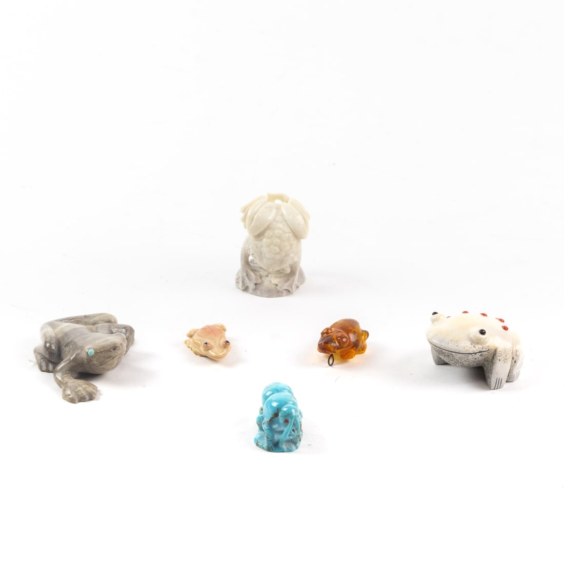 A lot of six Zuni fetish stone or bone carvings of frogs: A lot of six Zuni fetish stone or bone carvings of frogs, some signed, the largest 3"l